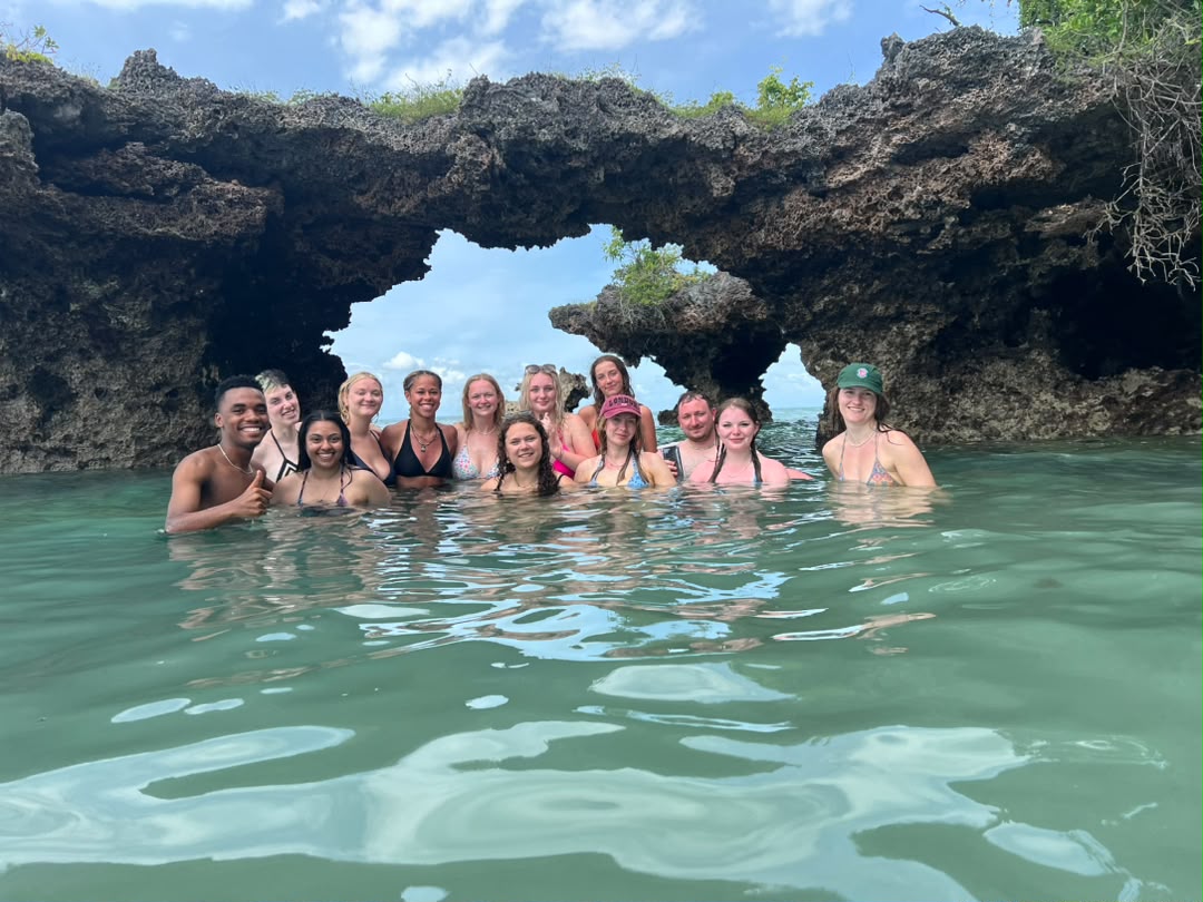 Guests swimming in a coral lagoon in Zanzibar