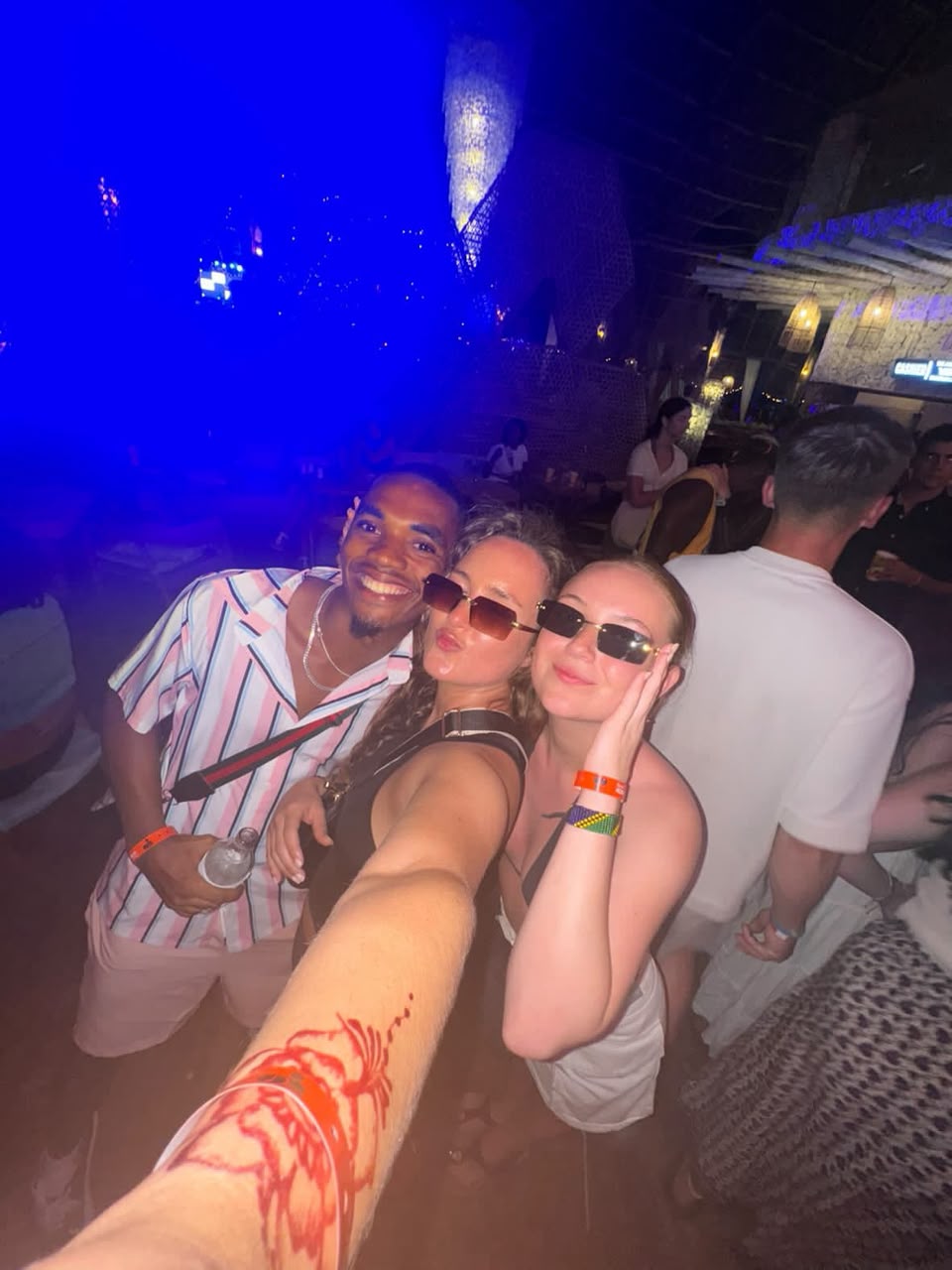 Group selfie at a Zanzibar beach club at night