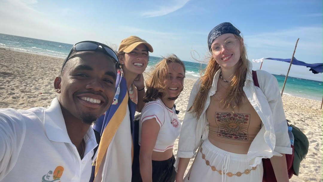 Dynasty guide with guests on a Zanzibar beach